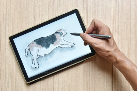 a tablet showing hand sketch the drawing of beagle dog with digital pens on wood table, the concept of new technology for drawing and rendering of tabletの写真素材