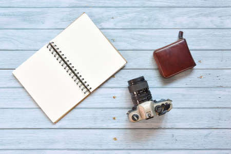Still life, business office or traveler memo concept, Top view image of open notebook with vintage...