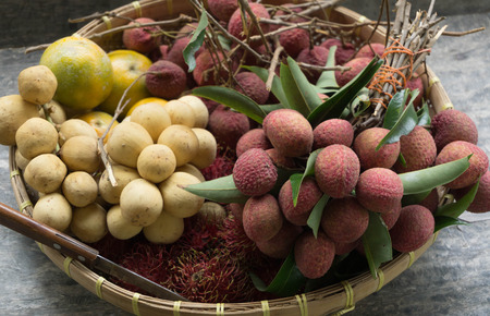 All season Thailand tropical fruits on brown old basketの写真素材