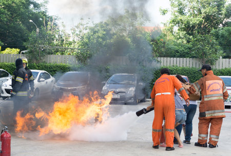 BANGKOK, THAILAND- JULY 31: Fire training by a firefighter on July 31, 2016 in Bangkok, Thailand.のeditorial素材