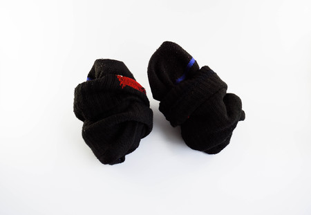 Used old socks  on white backgroundの写真素材