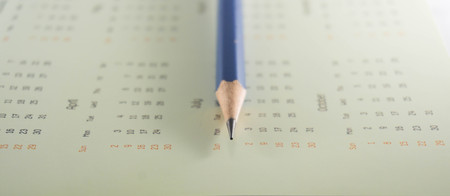Pencil on calendar backgroundの写真素材