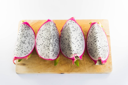 Dragon fruit on wooden chopping boardの写真素材
