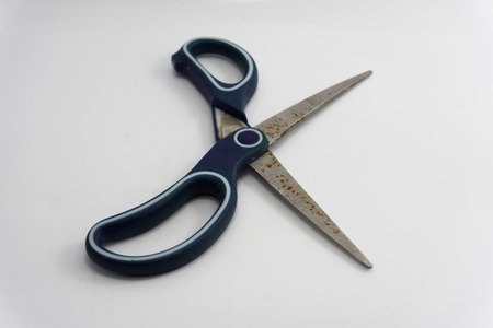 rusty scissors on a white backgroundの写真素材