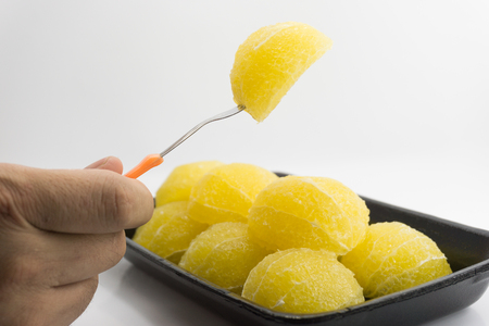 Slices of fresh orange fruit in plate on white backgroundの写真素材