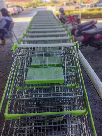 Shopping carts on parking lot at the supermarket.の写真素材