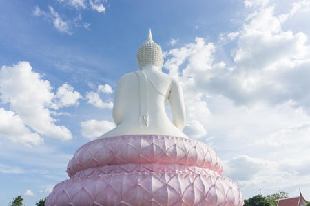 White Buddha statue on blue sky.の写真素材