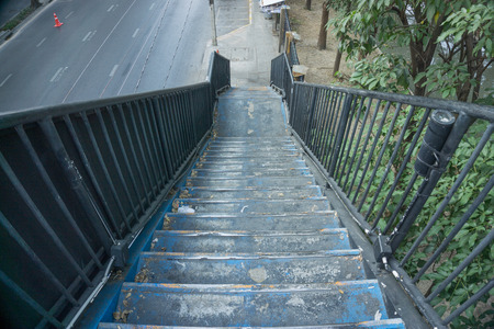 Old Stairs of the pedestrian overpass in the cityの写真素材