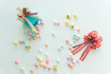 Top view blue gift box with ribbon and Colorful balls on white background.の写真素材
