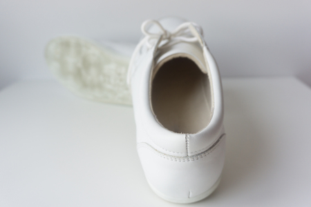 Men's white shoes on white background.の写真素材