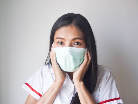 Young woman wearing a face mask. Healthcare And Medicine concept.の写真素材