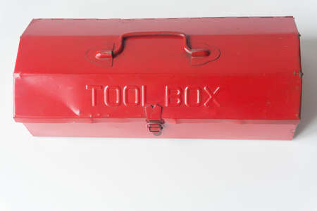 Red mechanic tool box on white background.