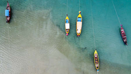 Aerial view of beautiful thai traditional wooden longtail boat on Phuket beach.の写真素材
