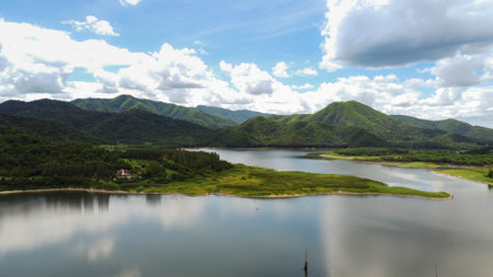 Panoramic view of beautiful mountains, river, and blue sky.の写真素材