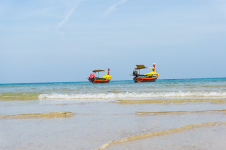 Sea sand sky and boat on the beach, Phuket Thailand.の写真素材