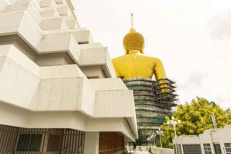 The back of big golden Buddha statue is under construction, Wat Paknam Bhasicharoen, Bangkok, Thailand.の写真素材