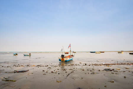The local long-tailed boats of Thai fishermen are moored on the coast.の写真素材