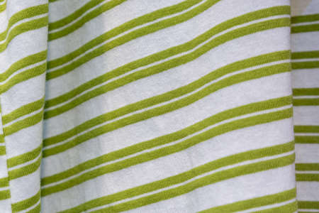 green and white shirt background in clothing store.の写真素材