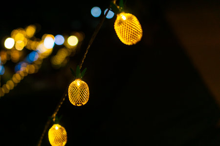 Pineapple-shaped yellow lights, Tent lights at night.