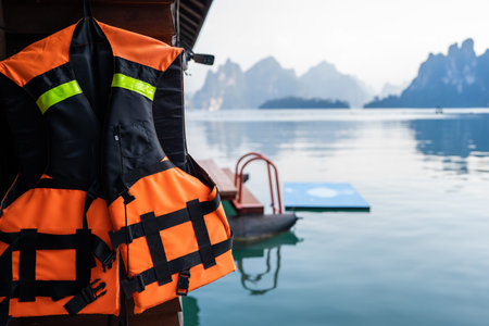 Life jackets hang outside the homestay, with beautiful mountain views in the morning.の写真素材