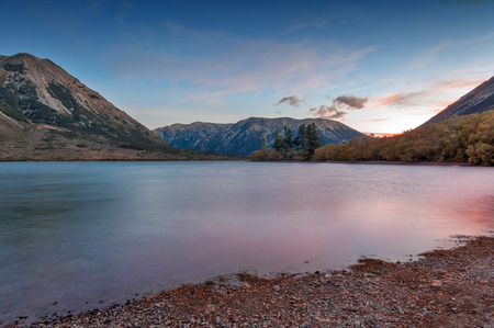 Sunset at Lake Pearson / Moana Rua Wildlife Refuge located in Craigieburn Forest Park in Canterbury region, South Island of New Zealandの写真素材