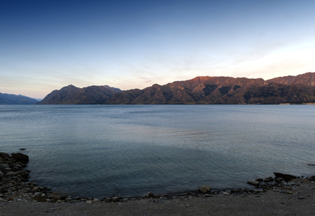Lake Hawea located in the Otago Region of New Zealand is a popular resort, and is well used in the summer for fishing, boating and swimmingの写真素材
