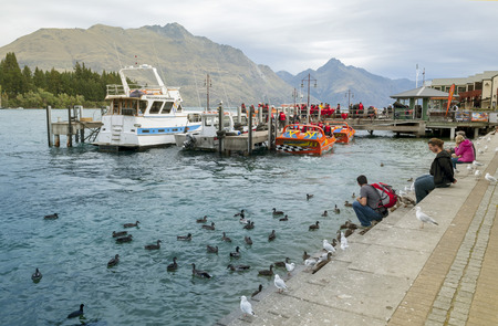 Queenstown, New Zealand - March 2016: Queenstown lakefront by Lake Wakatipu, New Zealandのeditorial素材
