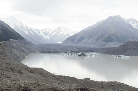 Tasman Glacier viewpoint where New Zealandâ??s longest glacier begins and the lower reaches where the ice meets the terminal lake, Aoraki / Mount Cook National Parkの写真素材