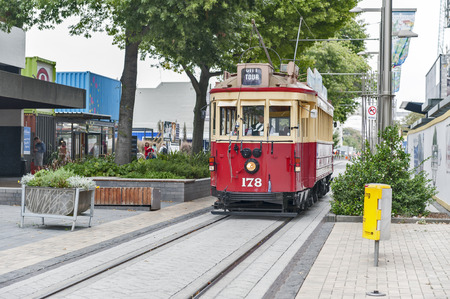 Christchurch, New Zealand - February 14, 2016: Vintage style tram on the Christchurch Tramway at the Re:Start Mall offers a unique city tour by the classic way of transportation in New Zealandのeditorial素材