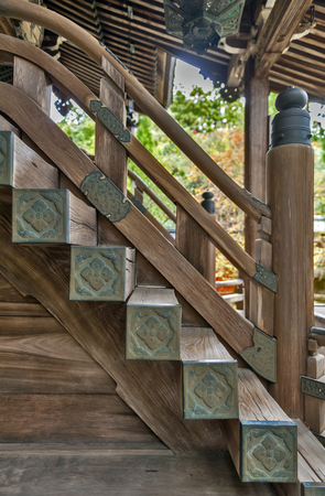 Japanese classic architecture of wooden stairway to a shrineの写真素材