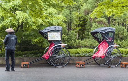 Kyoto, Japan - March 2016: Pulled rickshaw waiting for tourists at Torokko Arashiyama Station