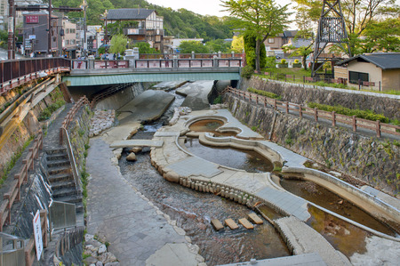 Kobe, Japan - March 2016: Hot spring stream flowing pass town centre of Arima Onsen in Kita-ku, Kobe, Japan.のeditorial素材