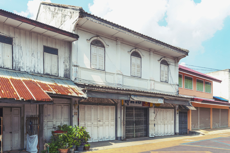 Classic Sino-Portuguese architectural style shophouse building at Ban Singha Tha, old historic area of Yasothon Province in the northeastern region of Thailandの写真素材