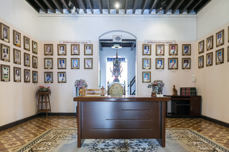 Nakhon Phanom, Thailand - May 2017: The working desk of former governors of Nakhon Phanom Province with their portrait photos being exhibited inside The Governor's House Museum in Nakhon Phanomのeditorial素材