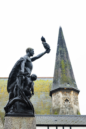 Kingston upon Thames, United Kingdom - April 2018: Bronze statue of a man and two children situated at War Memorial Gardens in town centre of Kingston upon Thames, Englandのeditorial素材