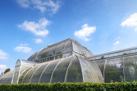 London, UK - April 2018: Palm House, an iconic Victorian glasshouse that recreates a rainforest climate for the exhibition of living unique collection of tropical plants from the tropical regions of the world, located at Kew Garden, Englandのeditorial素材