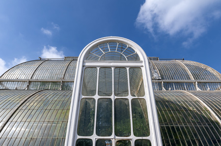 London, UK - April 2018: Palm House, an iconic Victorian glasshouse that recreates a rainforest climate for the exhibition of living unique collection of tropical plants from the tropical regions of the world, located at Kew Garden, Englandのeditorial素材
