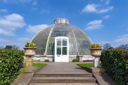 London, UK - April 2018: Palm House, an iconic Victorian glasshouse that recreates a rainforest climate for the exhibition of living unique collection of tropical plants from the tropical regions of the world, located at Kew Garden, Englandのeditorial素材