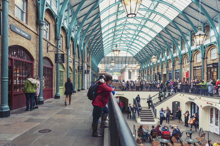 London, UK - April 2018: Interior of Covent Garden Market, a place for fashionable retail stores and dining on popular tourist site surrounded by historical buildings, theatres and entertainment facilities in Westminster City, Greater Londonのeditorial素材