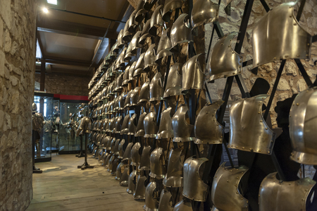 London, UK - April 2018: Collections of the Royal Armouries including historic arms and armours of previous kings of England exhibited inside the White Tower building at the Tower of London, royal palace and castle by the River Thames in London, Englandのeditorial素材