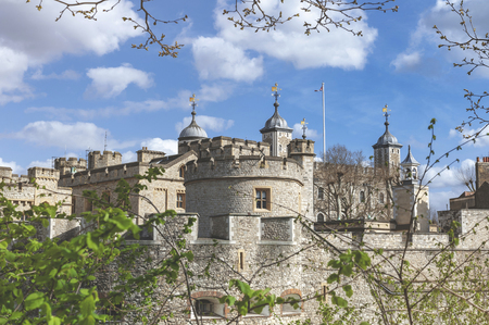 London, UK - April 2018: Exterior view of Her Majesty's Royal Palace and Fortress of the Tower of London, a historic castle and popular tourist attraction located on the north bank of the River Thames in central London, Englandのeditorial素材