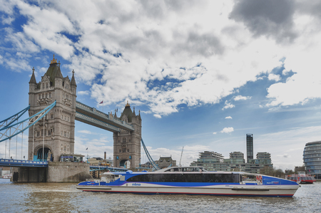 London, UK - April 2018: Tower Bridge, a combined bascule and suspension bridge with twin towers crossing the River Thames which becomes an iconic landmark and major tourist attraction of London, Englandのeditorial素材