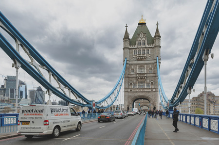 London, UK - April 2018: Tower Bridge, a combined bascule and suspension bridge with twin towers crossing the River Thames which becomes an iconic landmark and major tourist attraction of London, Englandのeditorial素材