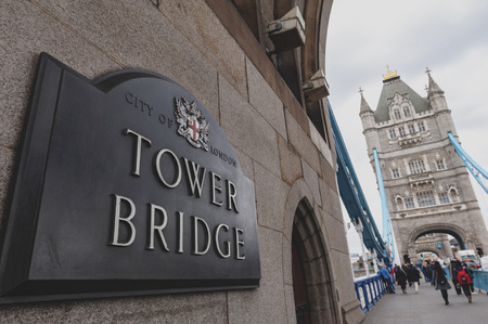 London, UK - April 2018: Tower Bridge, a combined bascule and suspension bridge with twin towers crossing the River Thames which becomes an iconic landmark and major tourist attraction of London, Englandのeditorial素材