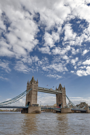 London, UK - April 2018: Tower Bridge, a combined bascule and suspension bridge with twin towers crossing the River Thames which becomes an iconic landmark and major tourist attraction of London, Englandのeditorial素材