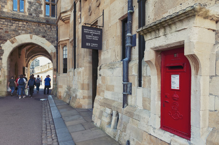 Windsor, UK - April 2018: A red British Wall box set into a wall at Windsor Castle, a royal residence at Windsor in county of Berkshire, England, UKのeditorial素材