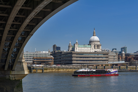 London, UK - April 2018: Riverbank of the Thames under Blackfriars Bridge with St Paul Cathedral, famous and recognizable religious sight of London in England, UKのeditorial素材
