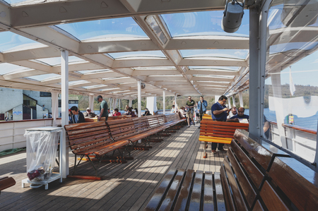 South Lakeland, UK - April 2018: Tourists enjoying boat cruise at Lake Windermere from...