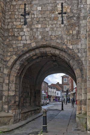 York, England - April 2018: Thoroughfare under Monk Bar, main gatehouses or bars of York City Walls, (Bar Walls or Roman walls), leading to old city of York, England, UKのeditorial素材
