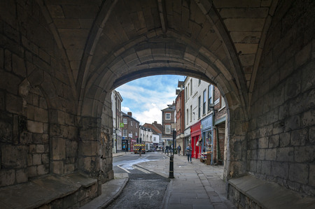 York, England - April 2018: Thoroughfare under Monk Bar, main gatehouses or bars of York City Walls, (Bar Walls or Roman walls), leading to old city of York, England, UKのeditorial素材